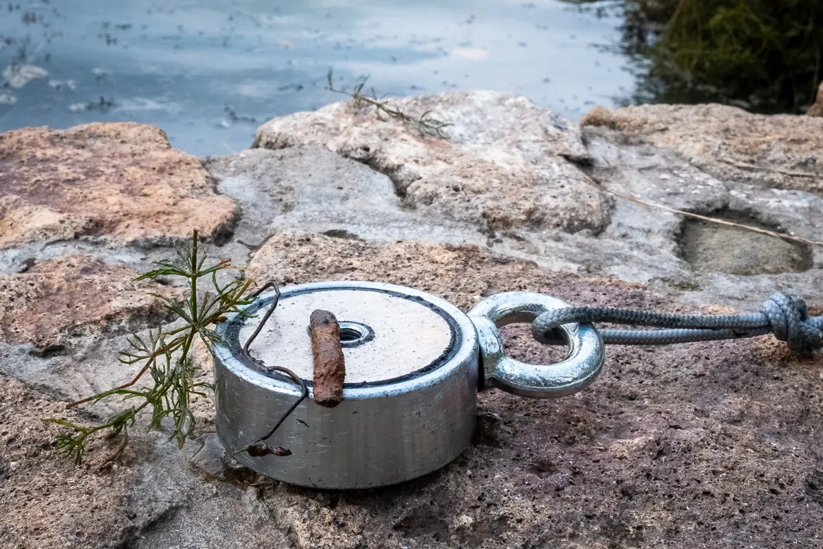 Fishing magnet on a rock